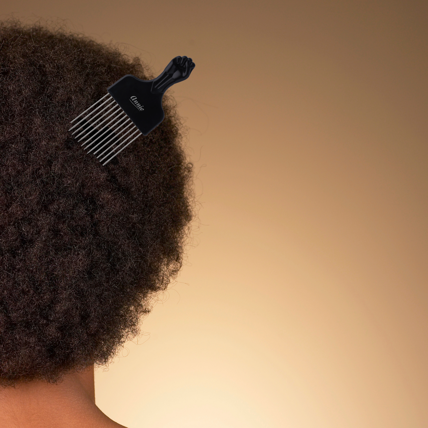 Annie Afro Styling Pik 2.5" Regular Black with metal teeth in natural afro hair for styling and detangling.