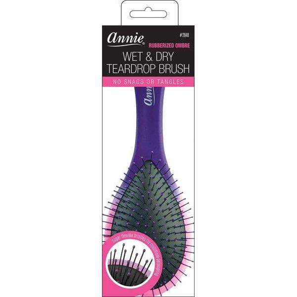 Purple teardrop-shaped detangling brush with rubberized ombre handle and flexible bristles designed for smooth styling on wet or dry textured and multicultural hair.