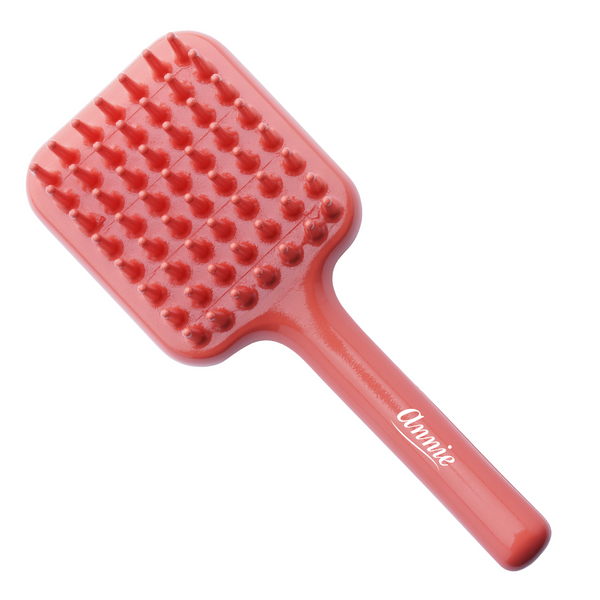 Orange Annie Effortless Detangler Brush with wide plastic teeth designed to gently detangle thick and curly hair.