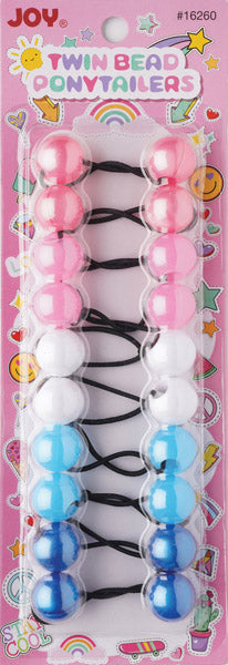 Colorful twin bead ponytail holders arranged in pairs on black elastic bands, designed for textured hair with pink, white, light blue, and dark blue beads on a bright, playful packaging.
