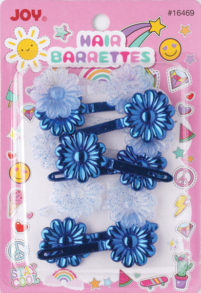 A set of four JOY brand hair barrettes in a pink retail blister pack. The set includes two metallic blue flower-shaped barrettes, two translucent white flower-shaped barrettes, and two matching blue and white barrettes with glittery white ruffles.