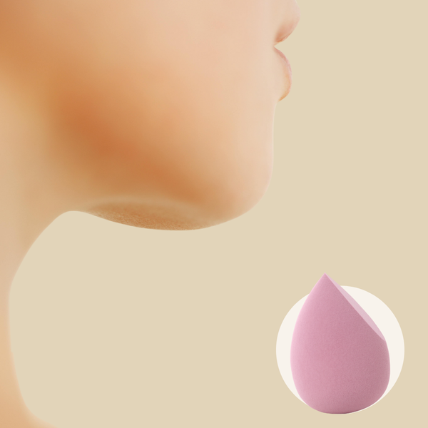 Close-up of a person’s chin and neck with a pink makeup sponge on a beige background