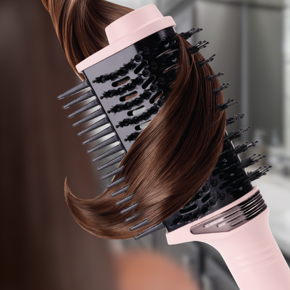 Hair dryer with comb attachment styling brown hair