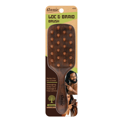 Annie Loc and Braid paddle brush with wooden bristles designed for detangling, scalp care, and frizz control on textured and natural hair.