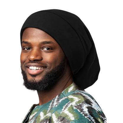 Man wearing black Mr. Durag Dreadlocks Wave Cap X-Jumbo with a patterned green and white shirt smiling at camera