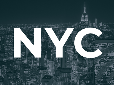 Nighttime cityscape of New York with the Empire State Building and large white NYC text overlay