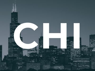 Nighttime skyline of Chicago city with illuminated buildings and large white letters CHI overlaid in center