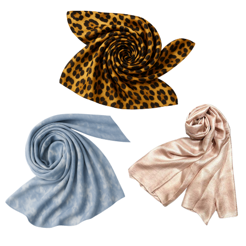 Three scarves arranged in spirals against a transparent background with leopard print, light blue, and beige colors