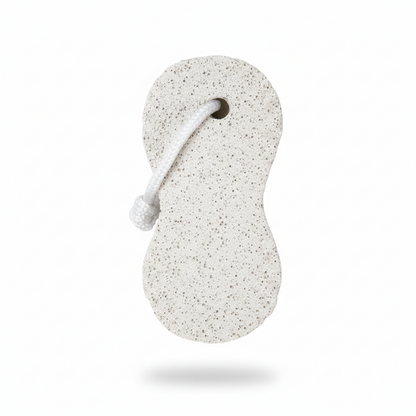 White peanut-shaped pumice stone with standard grit and attached rope loop, designed for exfoliating and smoothing skin.