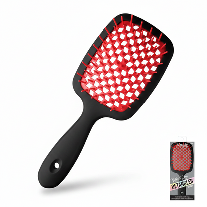 Black paddle brush with red flexible bristles designed to gently detangle wet and dry textured hair, shown alongside its original packaging from Annie International.