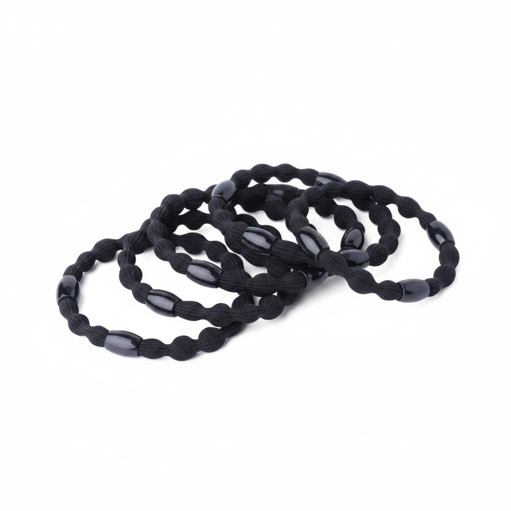 Six black elastic hair ponytail holders with decorative beads, designed for durable, snag-free styling on textured and natural hair by Annie International.