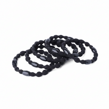 Six black elastic hair ponytail holders with decorative beads, designed for durable, snag-free styling on textured and natural hair by Annie International.