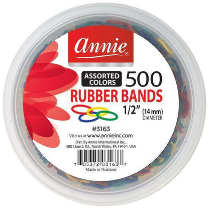 Clear plastic round container filled with 500 assorted color rubber bands, labeled with Annie branding and product details, designed for hair styling and care use.