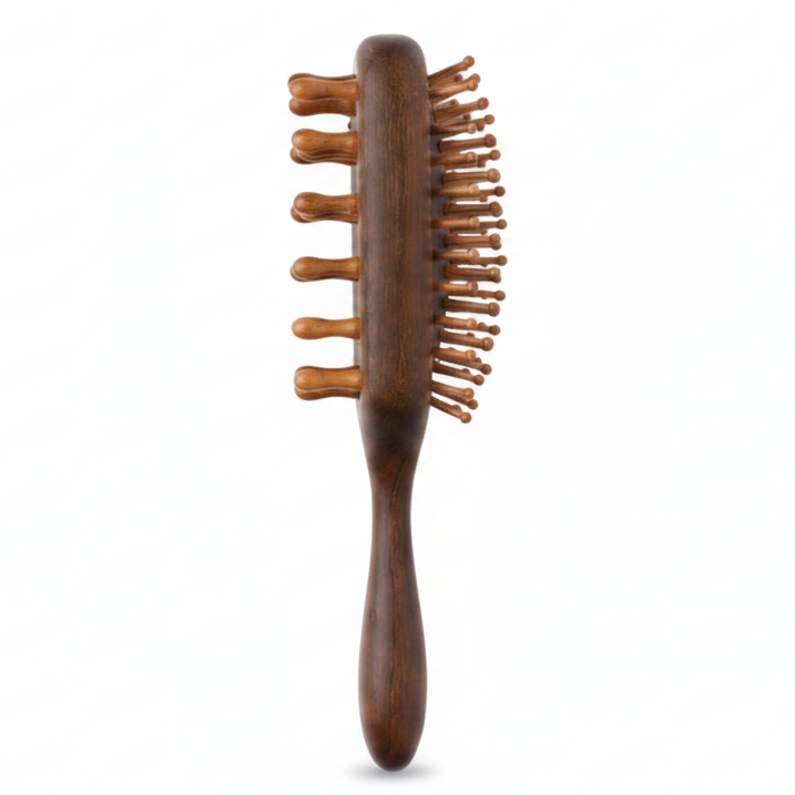 Rectangular sandalwood hair brush with ergonomic handle and widely spaced wooden bristles designed for detangling and styling textured and multicultural hair gently and effectively.