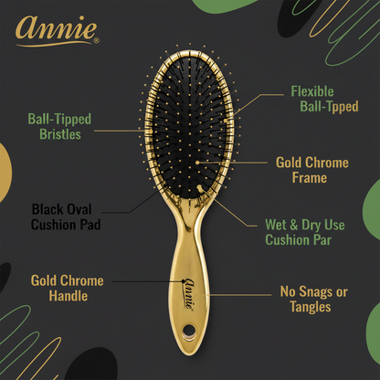 Gold chrome oval hairbrush with flexible ball-tipped bristles, black cushion pad for wet and dry use, designed to prevent snags and tangles on textured hair.