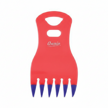 Red claw comb with blue-tipped teeth and ergonomic handle, designed by Annie for easy detangling and styling of textured, natural, and multicultural hair.