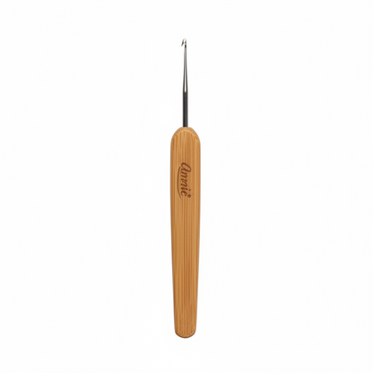 Annie Dreadlocks Crochet Needle 1 Hook 0.75mm, 1 Count, Wood featuring a smooth wooden handle with the Annie logo and a fine metal hook designed for precise dreadlock styling and maintenance.