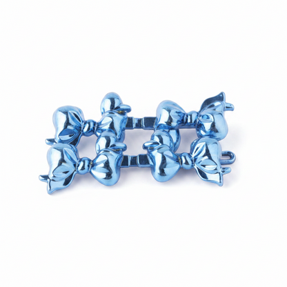Set of metallic blue bow-shaped hair barrettes designed for secure, snag-free styling on textured and multicultural hair, ideal for braiding or twisting.