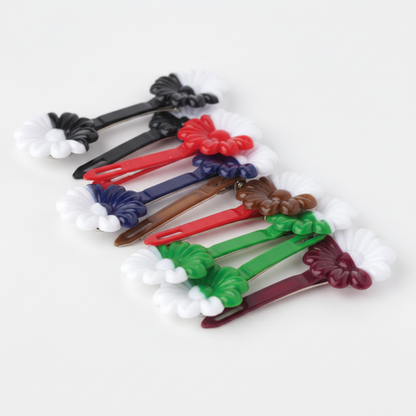Assorted two-tone daisy barrettes in multiple colors, designed for textured and multicultural hair, offering a smooth, snag-free hold from Annie International.