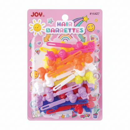Colorful assortment of bow-shaped barrettes in bright pink, orange, yellow, white, purple, red, and blue on decorative pink card packaging designed for textured and multicultural hair.