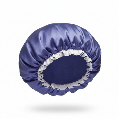 Medium-sized satin bonnet in rich purple with contrasting white elastic trim, designed to gently protect and maintain textured hair with a smooth, comfortable fit.