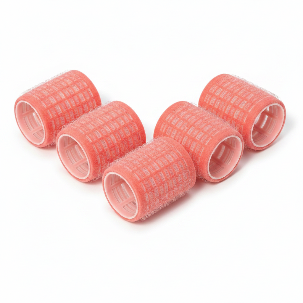 Six pink self-grip hair rollers measuring 1 5/8 inches, featuring a velour texture and hollow core, designed for gentle, no-pin curling on textured and natural hair types.