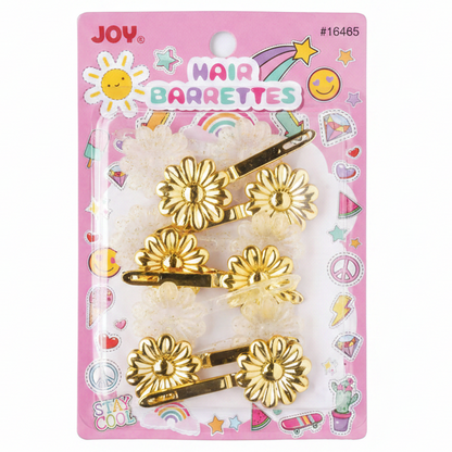 A package of four gold flower-shaped hair barrettes on a pink backing card with colorful doodles and the brand name JOY.