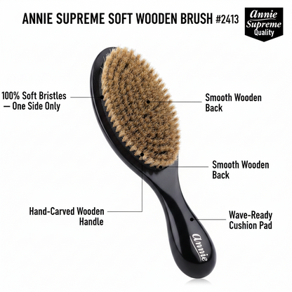 Black wooden hair brush with hand-carved handle, featuring a smooth back, wave-ready cushion pad, and soft boar bristles on one side for textured hair care.