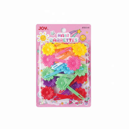 Assortment of colorful plastic snap hair clips shaped like daisies in bright yellow, pink, blue, green, purple, and red, displayed on a pink card with cheerful icons and Joy branding.