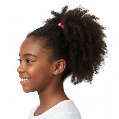 Young girl with natural textured hair styled in a puff secured by bright pink twin bead ponytailers designed for textured, multicultural hair by Annie International.