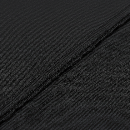 Close-up of black synthetic fabric with smooth, tightly woven texture and clean stitching, designed for a durable kids’ durag supporting wave training and protective styling.