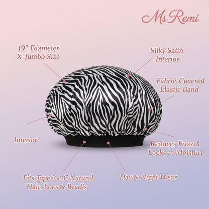 Extra-large zebra print satin cap with a silky interior and fabric-covered elastic band, designed for natural, textured hair to reduce frizz, lock moisture, and provide comfortable day and night wear.