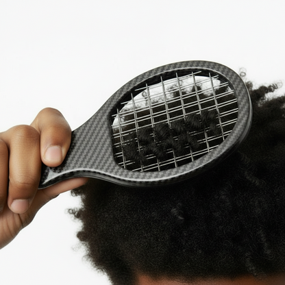 Close-up of a hand using a medium-sized carbon-colored twist and pik comb to style textured natural hair without snagging, designed for multicultural hair care.