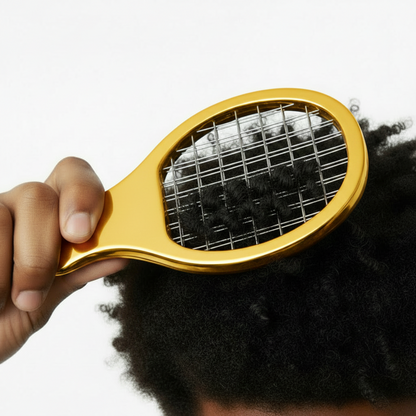 Hand holding a medium-sized gold twist and pik comb gently detangling tight, textured natural hair with no snags.