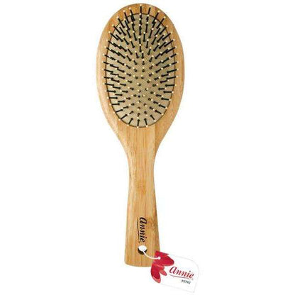 Light brown bamboo cushion oval brush with nylon bristles and rounded tips, designed by Annie for gentle detangling and styling of textured and multicultural hair types.