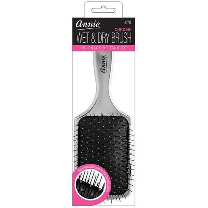 Silver paddle brush with flexible nylon bristles and cushioned base designed by Annie for smooth detangling and styling of textured and multicultural hair without snags or tangles.