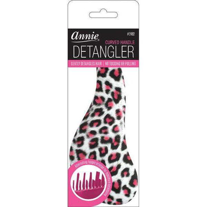 Detangling brush with a curved grip handle and cheetah-print design, featuring flexible bristles to gently remove tangles without pulling or tugging textured hair.