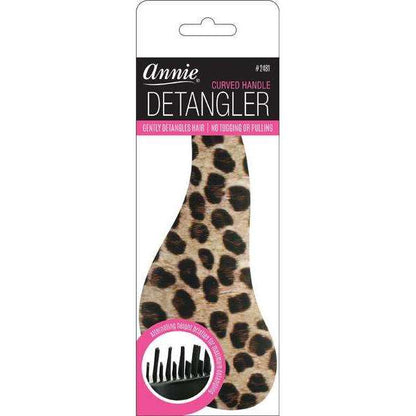 Leopard print detangling brush with ergonomic curved handle and firm flexible bristles designed by Annie for gentle, snag-free detangling of textured hair.