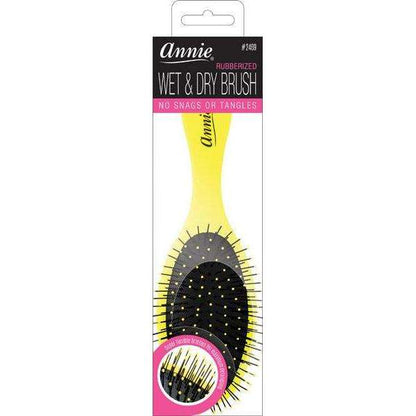 Yellow detangling brush with flexible black rubber bristles tipped with small balls, designed for gentle wet and dry hair care to prevent snags and tangles.