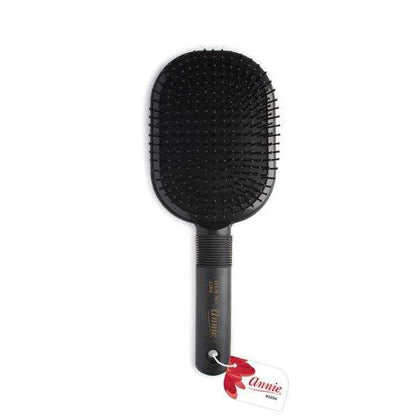 Black paddle cushion brush with flexible bristles designed for gentle detangling and smooth styling of textured and natural hair by Annie International.